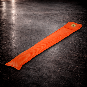 12 inch orange marker with grommet on industrial surface long orange fabric marker close up stitching detail
12 inch grip marker with metal grommet orange orange set marker large size on dark warehouse background
film production marker orange high visibility