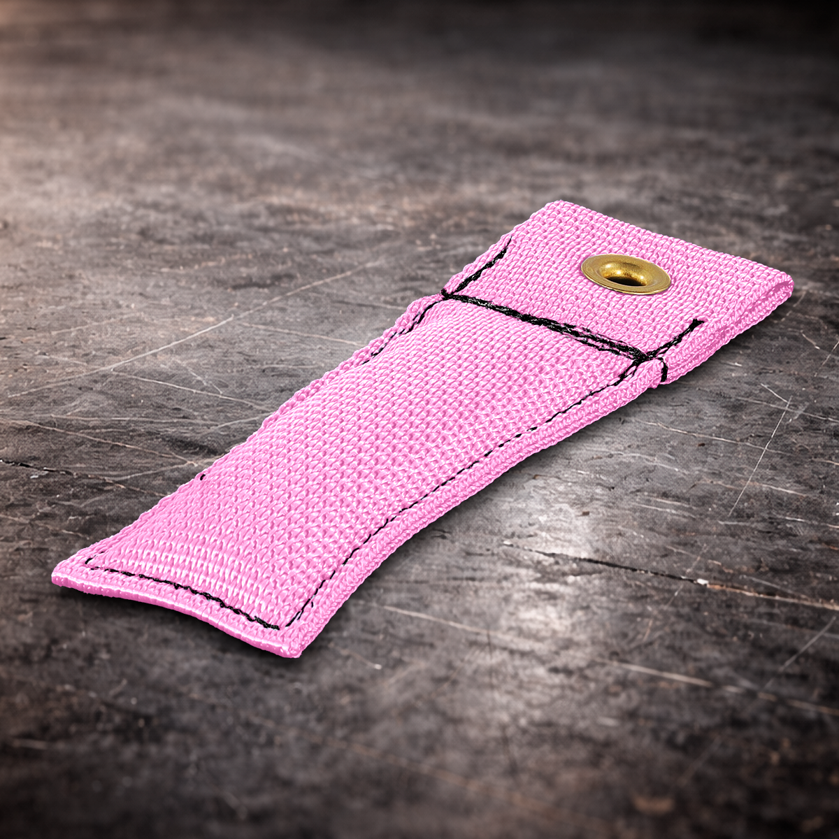 4 inch pink marker flag with grommet on industrial surface pink fabric marker close up showing stitching detail 4 inch grip marker with metal grommet for set marking pink set marker flag on dark warehouse background film production marker flag pink with grommet