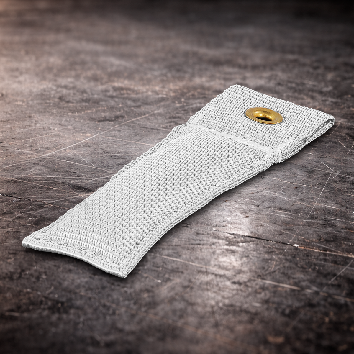 4 inch white fabric marker flag with brass grommet on industrial surface for film set marking white marker close up showing woven texture and reinforced stitching 4 inch grip marker flag with metal grommet used for staging and layout marking white set marking flag laid flat on dark warehouse surface with detailed fabric texture film production marker flag in white with grommet for grip department use
