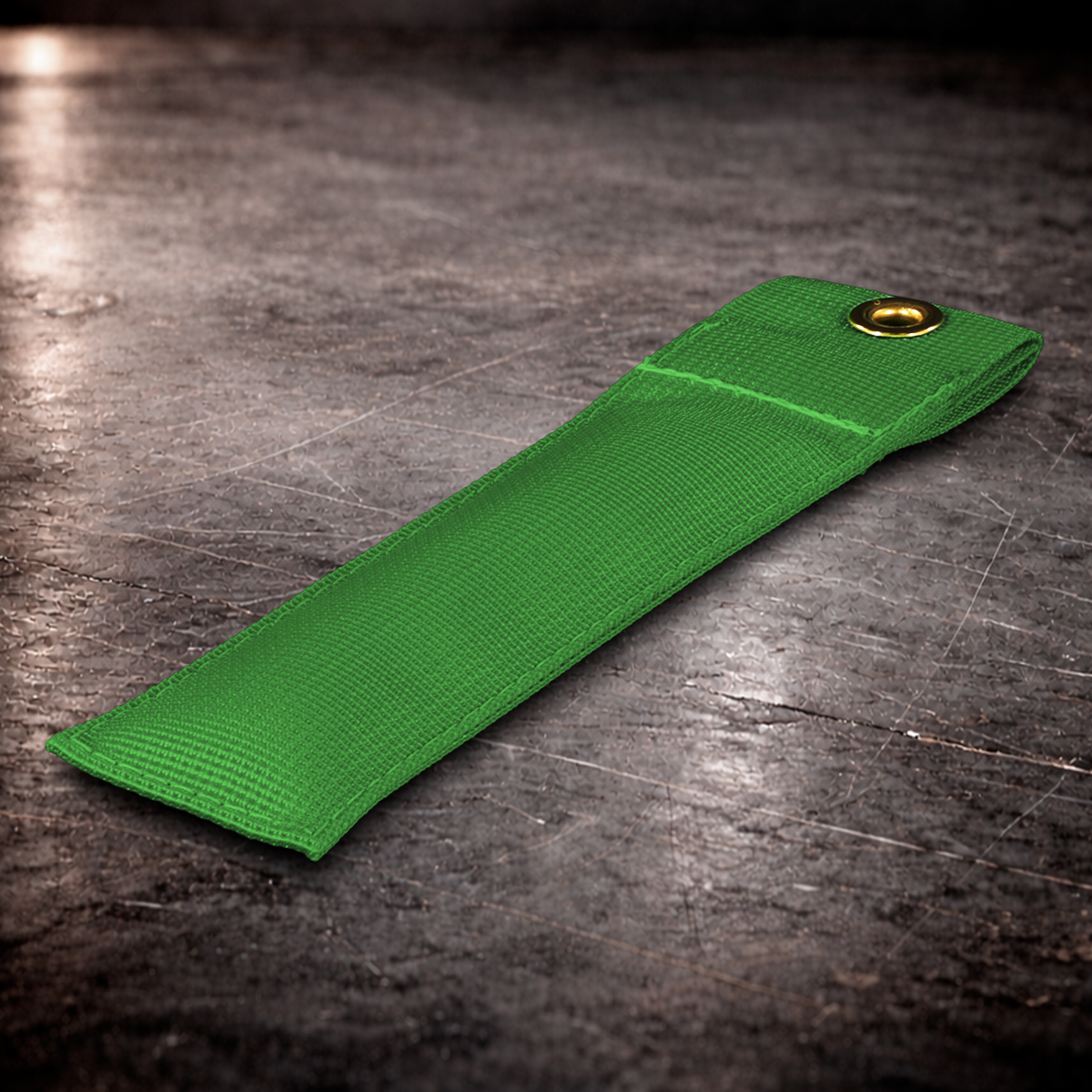 6 inch chroma green marker with grommet on industrial surface
chroma green fabric marker close up stitching detail 6 inch grip marker with metal grommet chroma green
green set marker on dark warehouse background film production marker chroma green with grommet