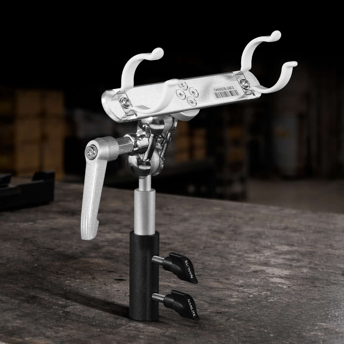 Nanlite T12 LED tube holder with adjustable ball head, swivel yoke, and integrated 5/8-inch baby pin for professional lighting setups