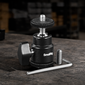 Cold shoe to 1/4"-20 adapter with swivel ball head for mounting monitors, LED lights, microphones, cameras, and professional camera rig accessories.