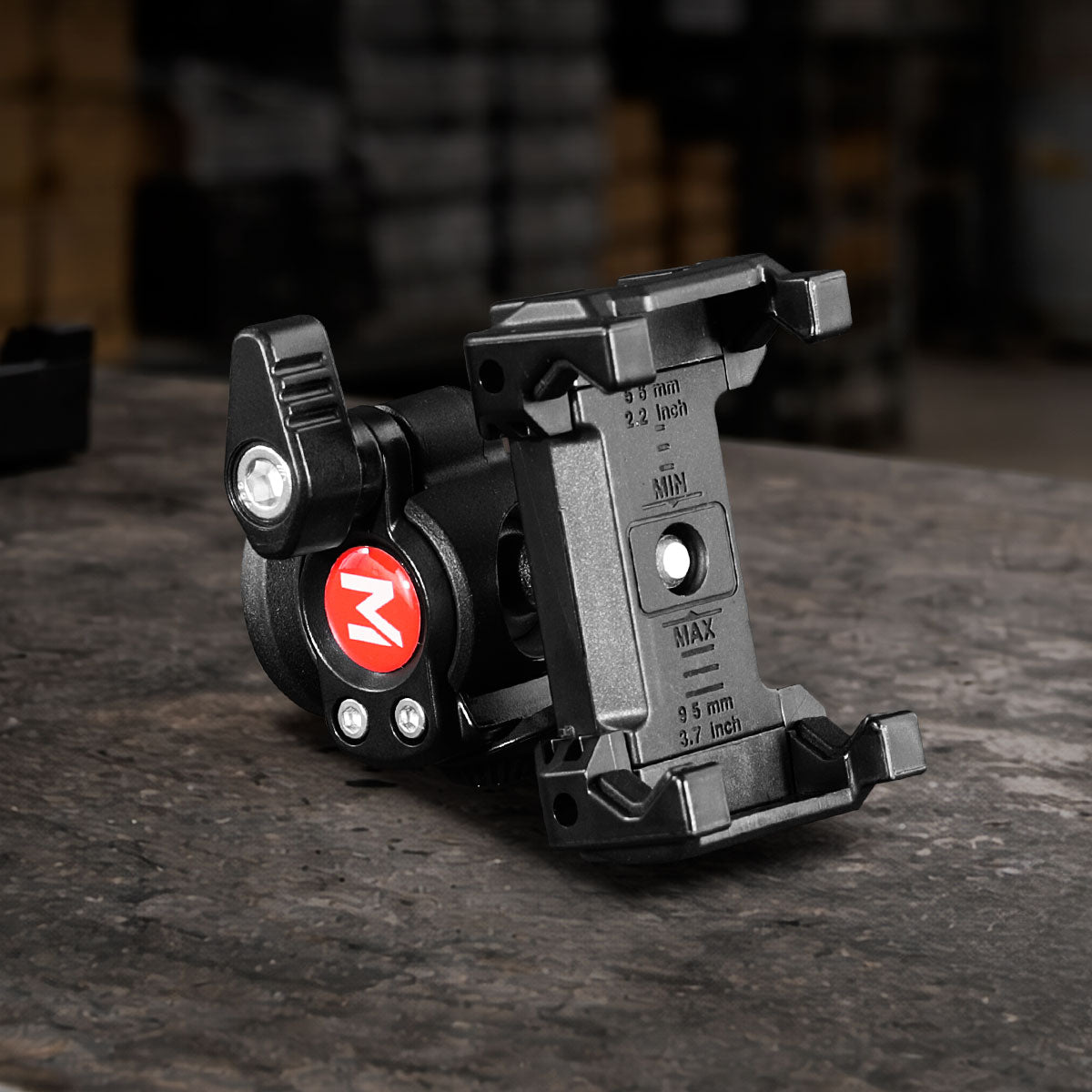 Universal Ball Head Phone Mount featuring a CNC-machined aluminum adjustable smartphone clamp with precision ball head for filmmaking, videography, photography, livestreaming, and content creation.