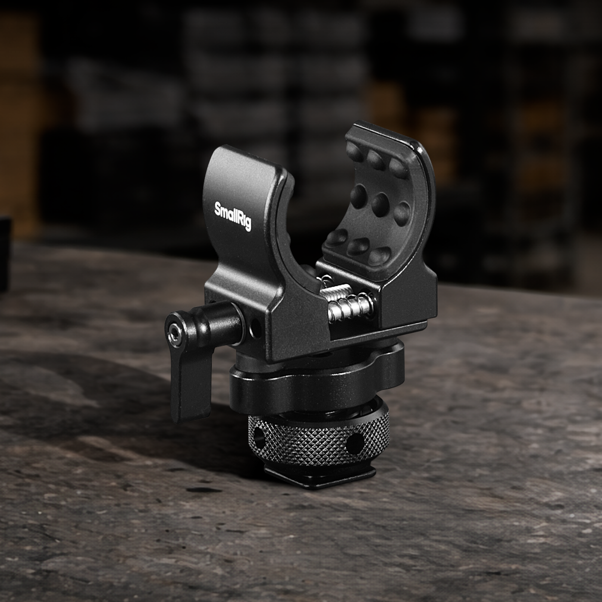 Aluminum microphone holder with 1/4"-20 mounting thread for shotgun microphones, camera rigs, cages, filmmaking, broadcasting, and professional audio production.
