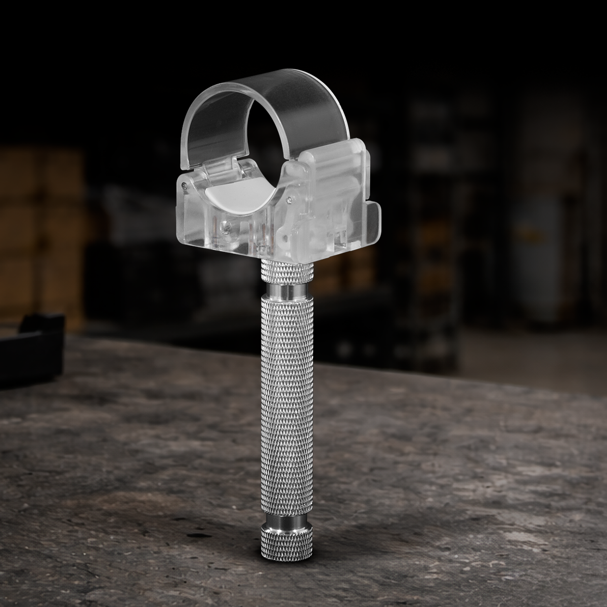 Nanlite PavoTube transparent clip with integrated 5/8-inch baby pin for securely mounting LED tube lights to C-stands, grip heads, and professional lighting equipment for film, video, and photography.
