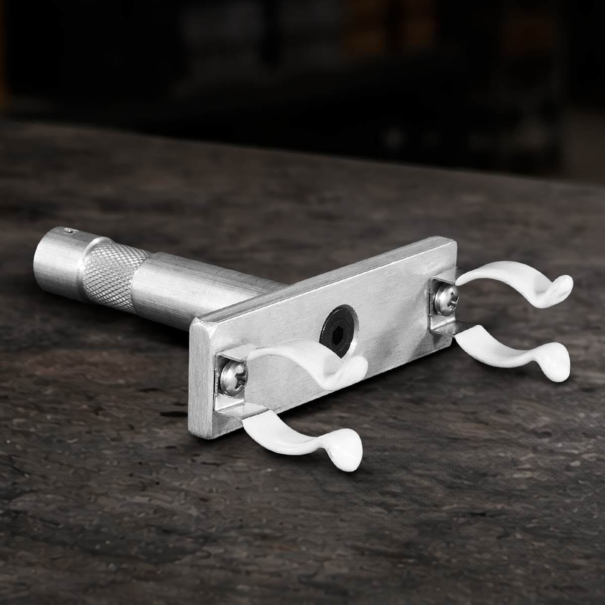 Professional T8 single lamp holder with rubber clips and 5/8" baby pin for film production, studio, broadcast, and practical lighting setups.