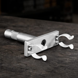 Professional T8 single lamp holder with rubber clips and 5/8" baby pin for film production, studio, broadcast, and practical lighting setups.