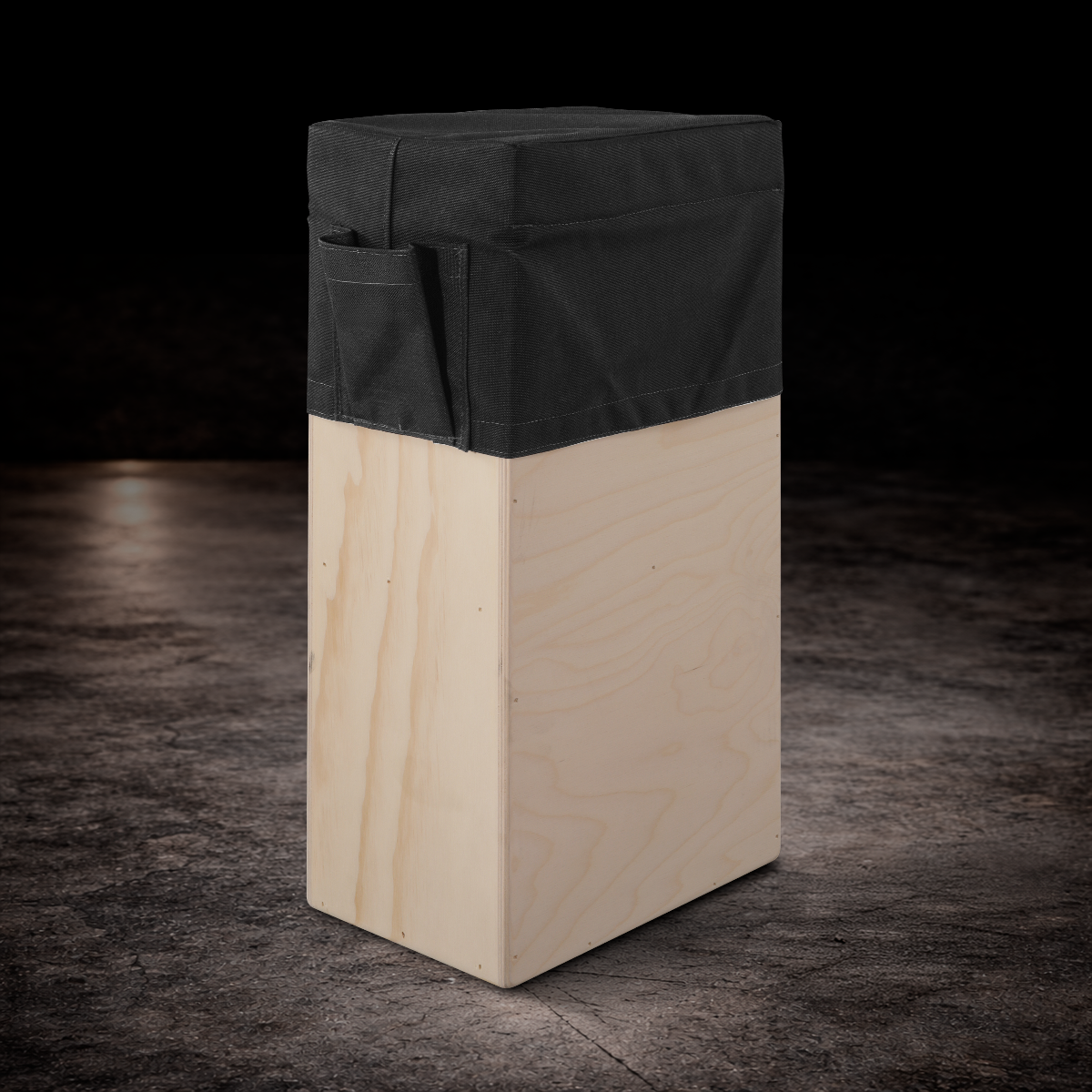 Black padded vertical apple box seat cover with side storage pocket for film production and on-set seating