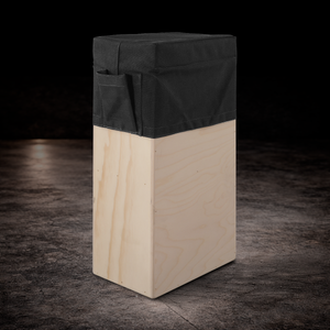 Black padded vertical apple box seat cover with side storage pocket for film production and on-set seating