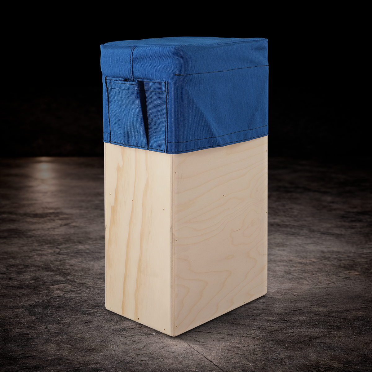 Blue padded vertical apple box seat cover with side storage pocket for professional film production and on-set seating