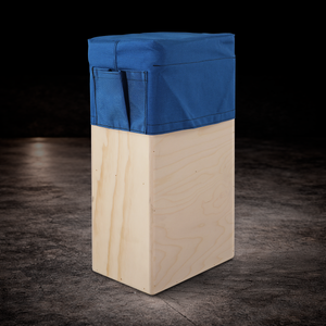 Blue padded vertical apple box seat cover with side storage pocket for professional film production and on-set seating